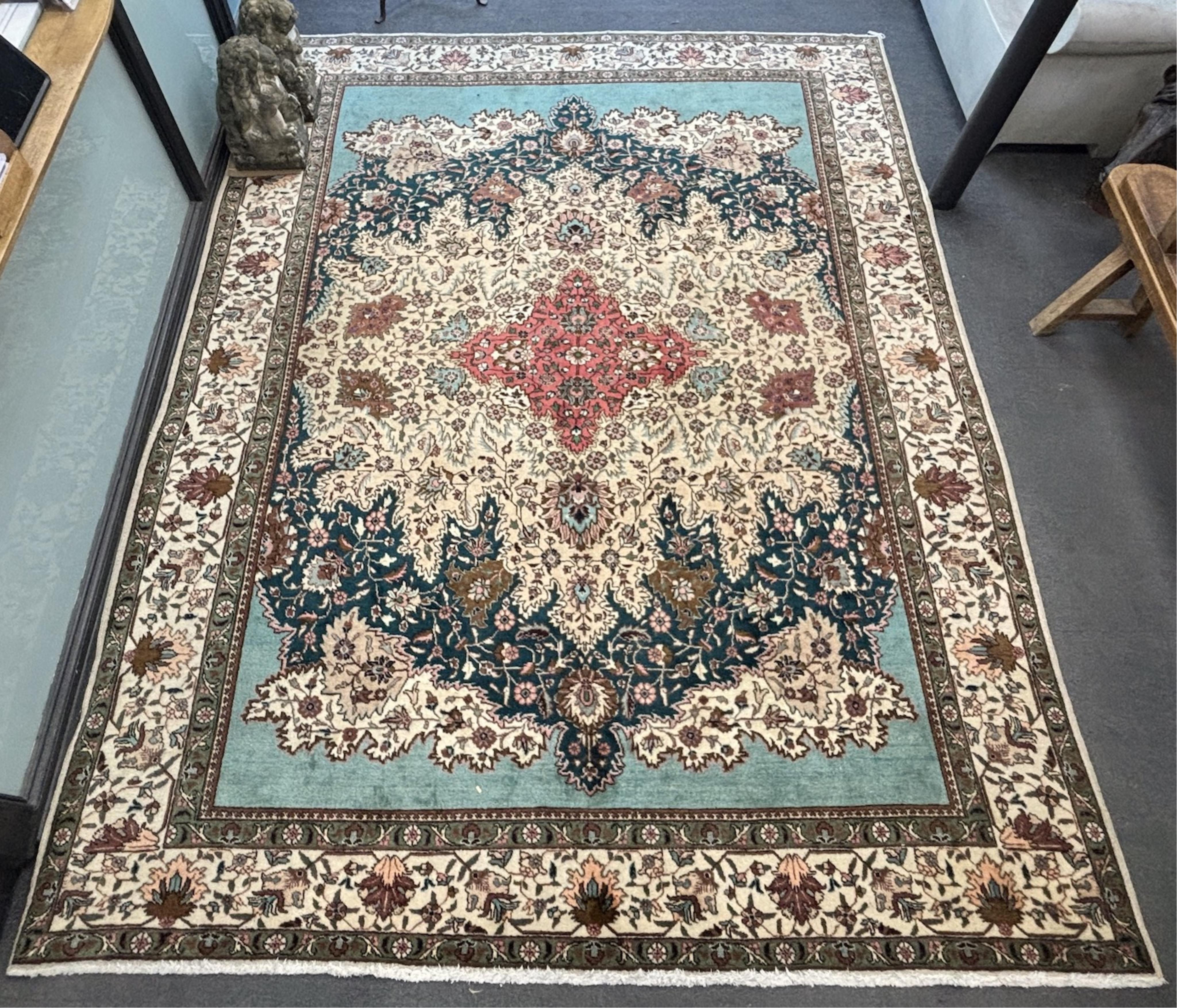 A Tabriz carpet, 400 x 310cm